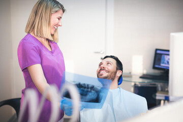 Young man at dentist. Shallow DOF. Developed from RAW; retouched with special care and attention;...