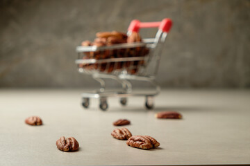 Savoring pecan nuts in a rustic kitchen with a playful cart