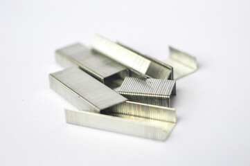 metal staples group on white background