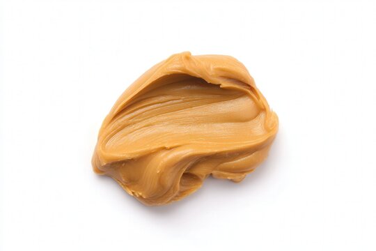 Spoonful of creamy peanut butter spread on white background