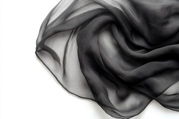 Elegant black sheer fabric softly draped showcasing texture and subtle light play on white