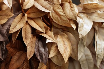 Naklejka premium A close-up shot reveals the beautiful details of layered leaves in warm, earthy tones.