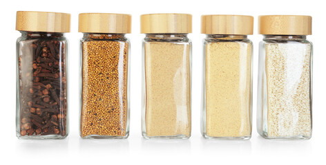 Many different aromatic spices in jars isolated on white