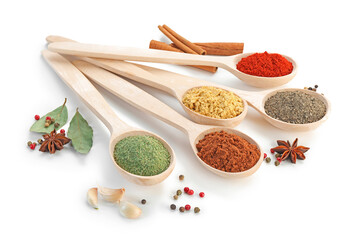 Different aromatic spices in spoons isolated on white