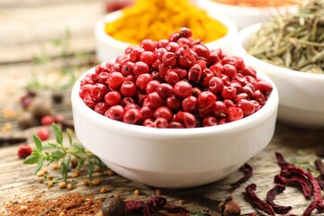 Different aromatic spices on wooden table, closeup