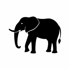 Obraz premium Silhouette of a black elephant with tusks and trunk raised