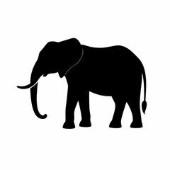Fototapeta premium Silhouette of a black elephant with tusks and trunk raised