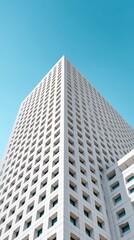 Obraz premium Modern Architectural Design of a Skyscraper Against Clear Sky