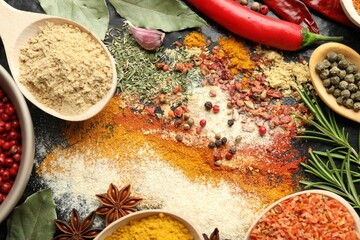 Different aromatic spices on black background, closeup