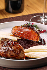 Portion of gourmet grilled beef steak with mashed potato and sauce