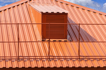house with red metal tile roof