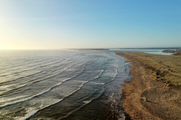 Beautiful seascape. Drone video of water crashing against the coast and cliffs, prince edward island Canada.
