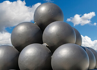 A pyramid of black solid shots