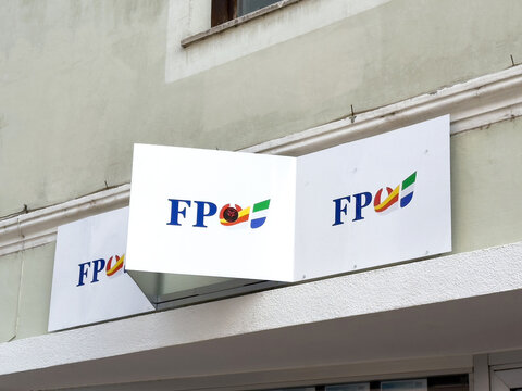 FP&Ouml; logo signage displayed on a modern building exterior, showcasing vibrant colors and unique design elements, representing a contemporary brand identity in urban architecture