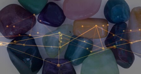 Polished stones being connected by glowing golden network nodes and mesh, in animated illustration - Powered by Adobe