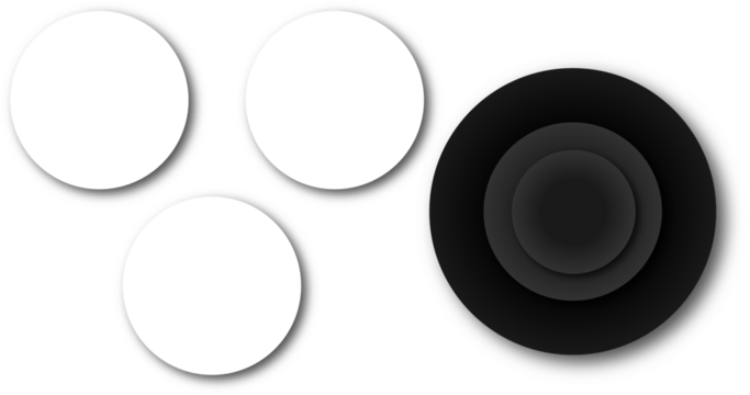 Three white circles and a black concentric circle design on a light gray background surface top view