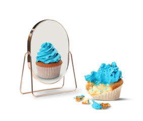 Bitten cupcake reflecting in mirror as whole, white background. Opposite, contrast, difference