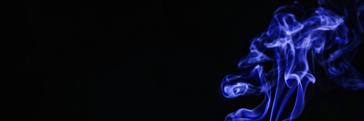 Bright blue smoke in air on black background, space for text. Banner design