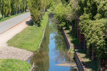 A stone moat near the walls of an ancient medieval castle