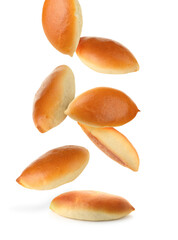 Yummy baked patties falling on white background