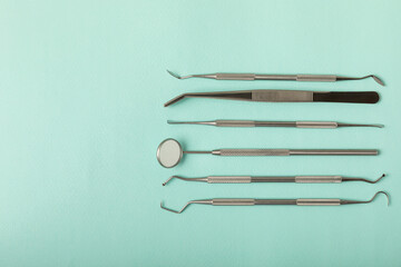 Dentist tools on a blue background. Dentist Concept.Teethcare, dental health concept. Means to care for the oral cavity. Dental model and dental equipment. Dental hygiene. Space for text. Copy space.