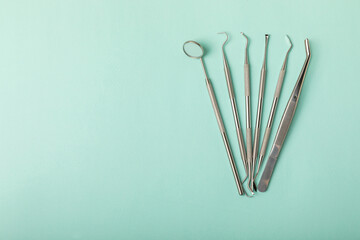 Dentist tools on a blue background. Dentist Concept.Teethcare, dental health concept. Means to care...