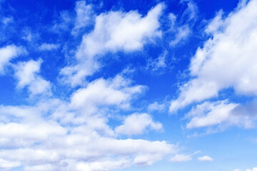Fototapeta premium Blue sky with white fluffy cloud. Cumulus clouds background. Cloudscape morning sky. The concepts of freedom of live, never give up and positive though energy.