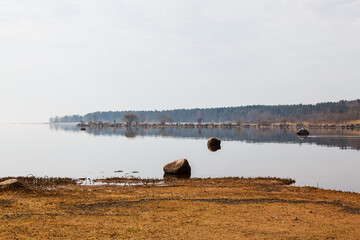 The seashore after low tide on a cloudy day.