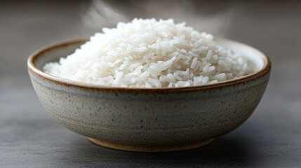 Steaming hot bowl of cooked rice