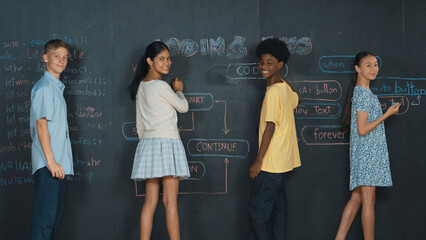 Diverse children planning to code program by using blackboard. People with mixed races writing...