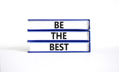Motivational be the best symbol. Concept words Be the best on beautiful blue white books. Beautiful...
