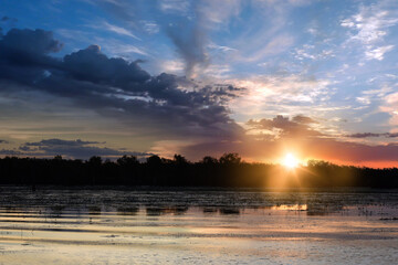spectacularly and colorful sunset at Yellow Waters Billabong, Kakadu National Park, Northern Territory, Australia