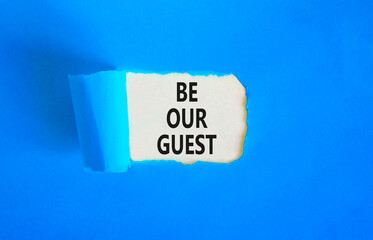 Be our guest symbol. Concept words Be our guest on beautiful white paper. Beautiful blue paper background. Business and be our guest concept. Copy space.