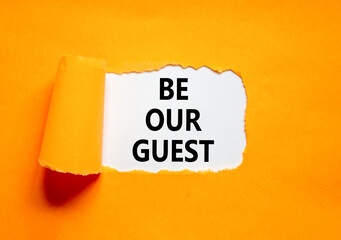 Be our guest symbol. Concept words Be our guest on beautiful white paper. Beautiful orange paper background. Business and be our guest concept. Copy space.