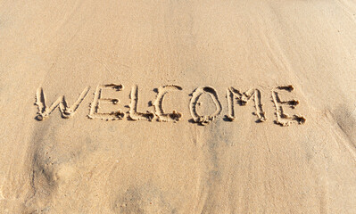 Business hello and welcome concept. Concept word Welcome written on beautiful Red sea ocean sand beach. Beautiful Red sea ocean sand beach background, copy space. Business hello and welcome concept.