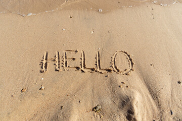 Business hello and welcome concept. Concept word Hello written on beautiful Red sea ocean sand beach. Beautiful Red sea ocean sand beach background, copy space. Business hello and welcome concept.