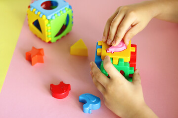 everyday children games. plastic construction kit and children hands