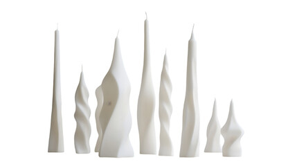 A collection of unique white candles with varying shapes and sizes displayed on a plain background 