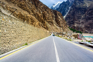 Towering ice cones and vast glaciers flank the Karakoram Highway, while the glacial Hunza River rushes alongside