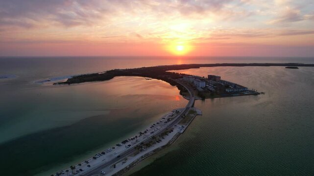 Florida. Panorama of Honeymoon Island State Park FL. Hurricane pass. Colorful sunset. Dunedin Causeway. Ocean beach. Gulf of Mexico or Gulf of America. Tropical Nature. Seascape photo. Aerial view