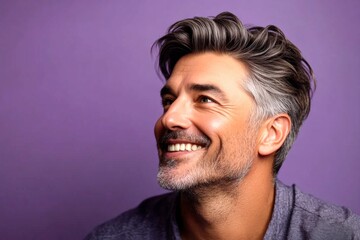 Obraz premium Purple solid background. Pattern of style for aging men. A graceful mature man with a modern hairstyle. Modish men's high and tight haircut - midlife white man with hair.