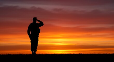 Silhouetted Soldier Saluting Fiery Sunset: A Patriotic Tribute