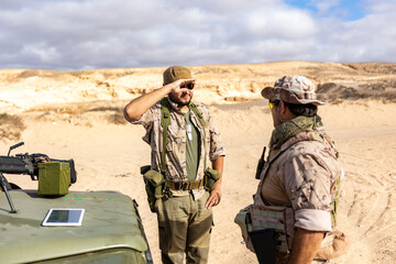 Military Personnel Communicating in a Desert Environment