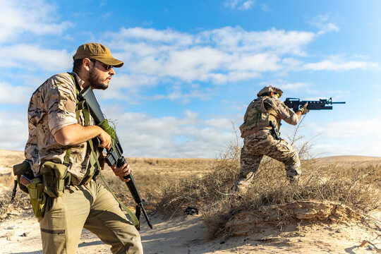 Military Training in Desert Terrain with Armed Soldiers