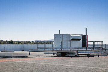 Industrial rooftop air conditioners under clear sky