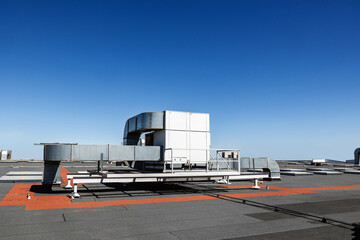 Industrial rooftop air conditioning system under clear sky