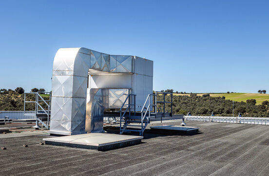Industrial rooftop air conditioning unit on a sunny day