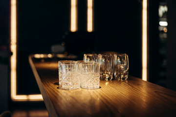 Elegant arrangement of empty glasses on a stylish bar