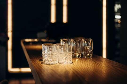 Elegant arrangement of empty glasses on a stylish bar