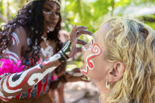 Traditional face painting experience on Waigeo Island, Indonesia